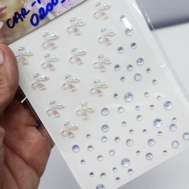 Aplique Adesivo / Laço 10mm (1 CARTELA) - Strass Transparente
